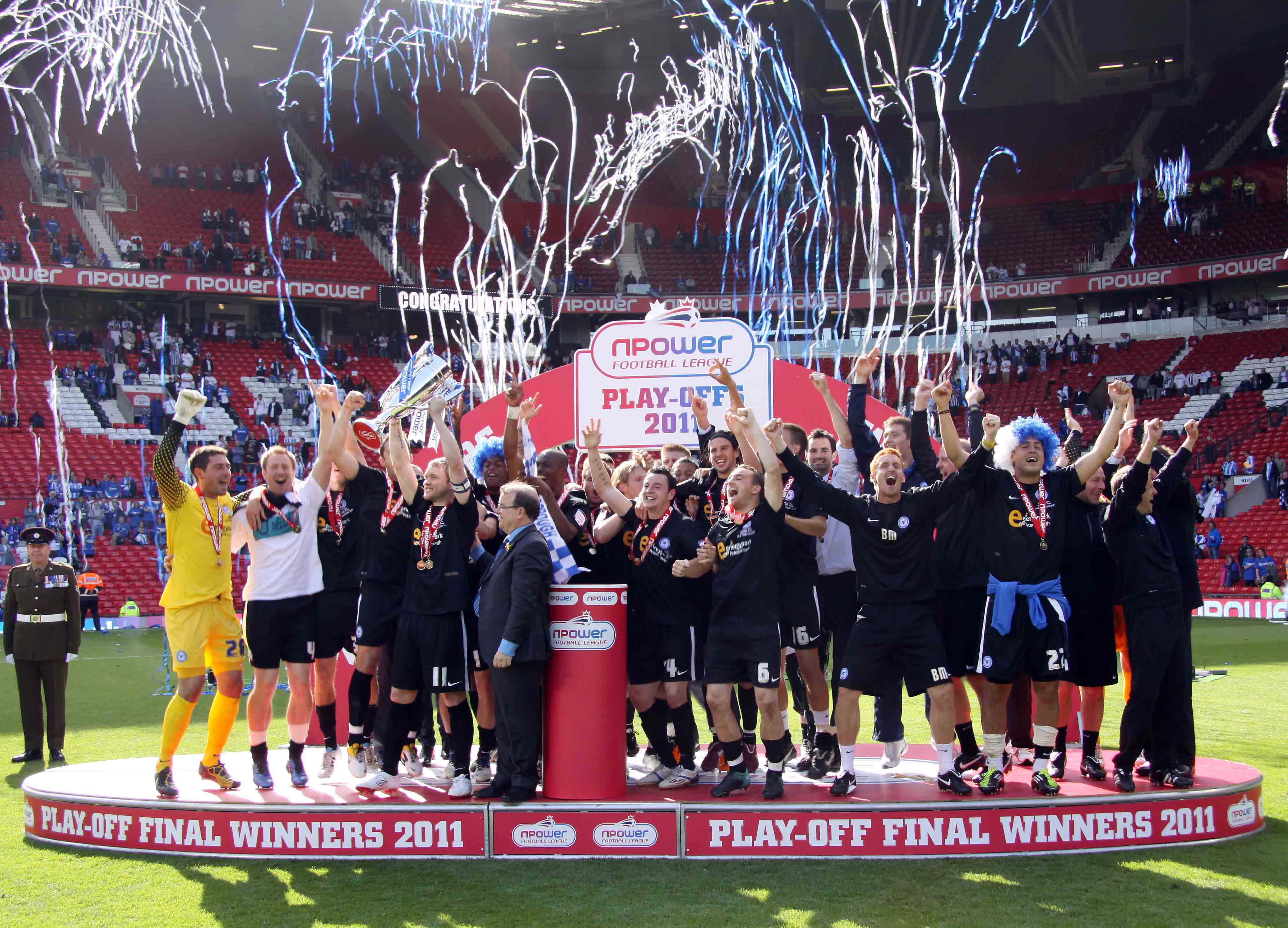 Posh celebrate winning promotion in the League One Play-Offs