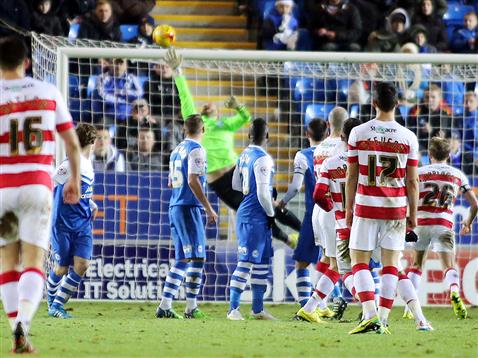 Ben Alnwick fails to touch the ball as Doncaster hit the cross bar