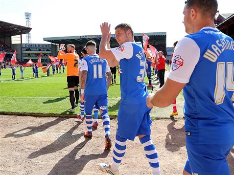 Harry Beautyman applauds the fans as the team comes out v Barnsley
