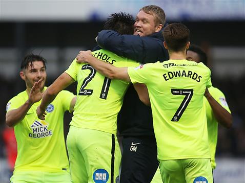 grant-mccann-celebrate-with-the-players-after-the-92nd-minute-winner-from-tom-nichols-v-bristol-rovers